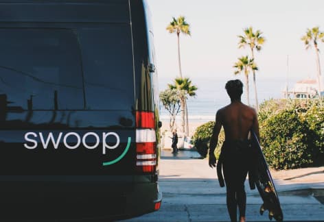 swoop van with surfer